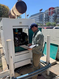 Tad Radecki, Chief of Installation Operations for PIONEER Systems, Inc., installs the first Power P.I.O.N.E.E.R. emergency power monitoring system at a Los Angeles County hospital on Aug. 4, 2021.