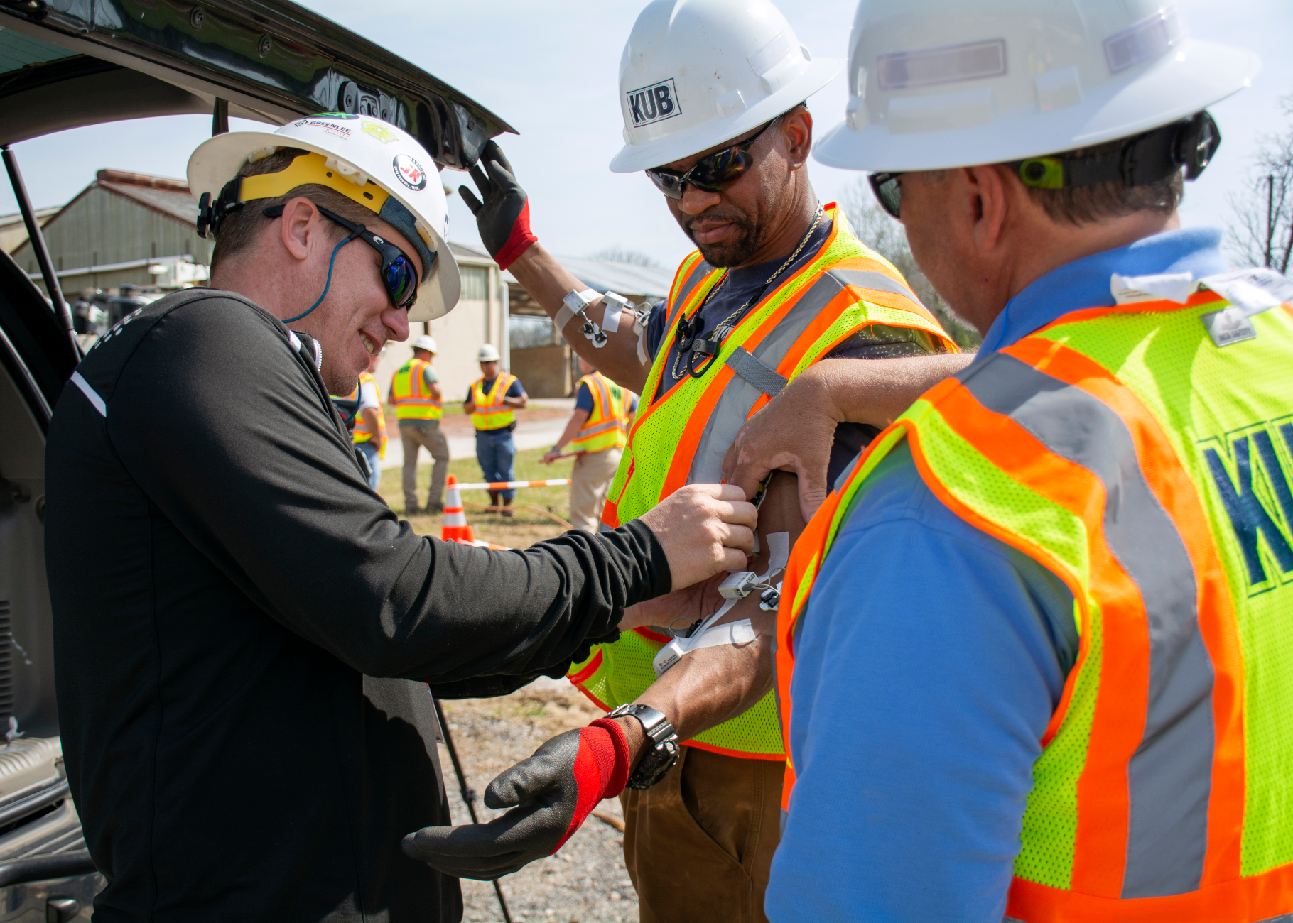A Greenlee team member places sensors on key pressure points of a Knoxville Utilities Board employee. The quantitative data from the sensors will help KUB add to its existing ergonomics strategy by showing employees how new tools and work processes have a long-term effect on their bodies.
