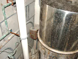 Electrical box on wall behind pool filter container