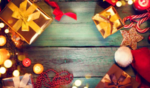 Festive holiday items sitting on a wood floor