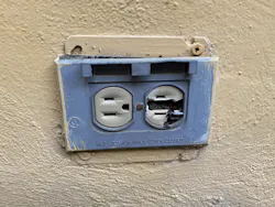 outdoor receptacle outlet with blue broken protective cover