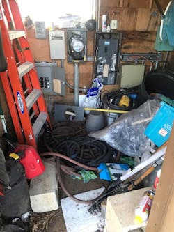 Material piled up in front of electrical equipment Material piled up in front of electrical equipment