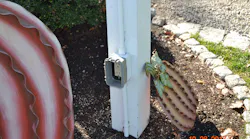 Outdoor receptacle outlet with a broken gray cover unit