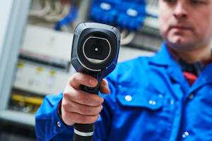 Safety Electrician Using Thermographic Imager