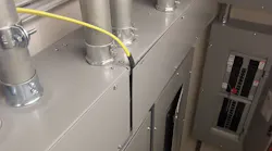 cable squeezed between the wireway and its cover