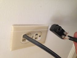 receptacle outlet with hole drilled for TV cable receptacle outlet with hole drilled for TV cable