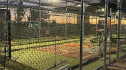Batting cages at night at Mesa Community College. Donated lights allow baseball players to practice at night.