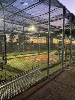 Batting cages at night at Mesa Community College. Donated lights allow baseball players to practice at night. Batting cages at night at Mesa Community College. Donated lights allow baseball players to practice at night.