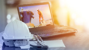 construction hat with laptop computer