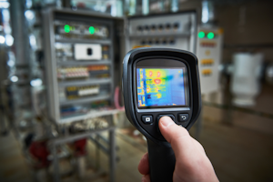 Handheld Infrared Unit Scanning a Control Panel