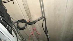black coaxial cables zip-tied to previously installed electrical metallic tubing