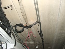 black coaxial cables zip-tied to previously installed electrical metallic tubing black coaxial cables zip-tied to previously installed electrical metallic tubing