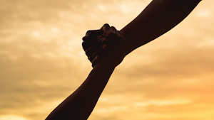 hands holding one another