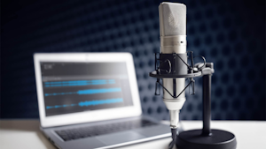 podcast microphone and laptop