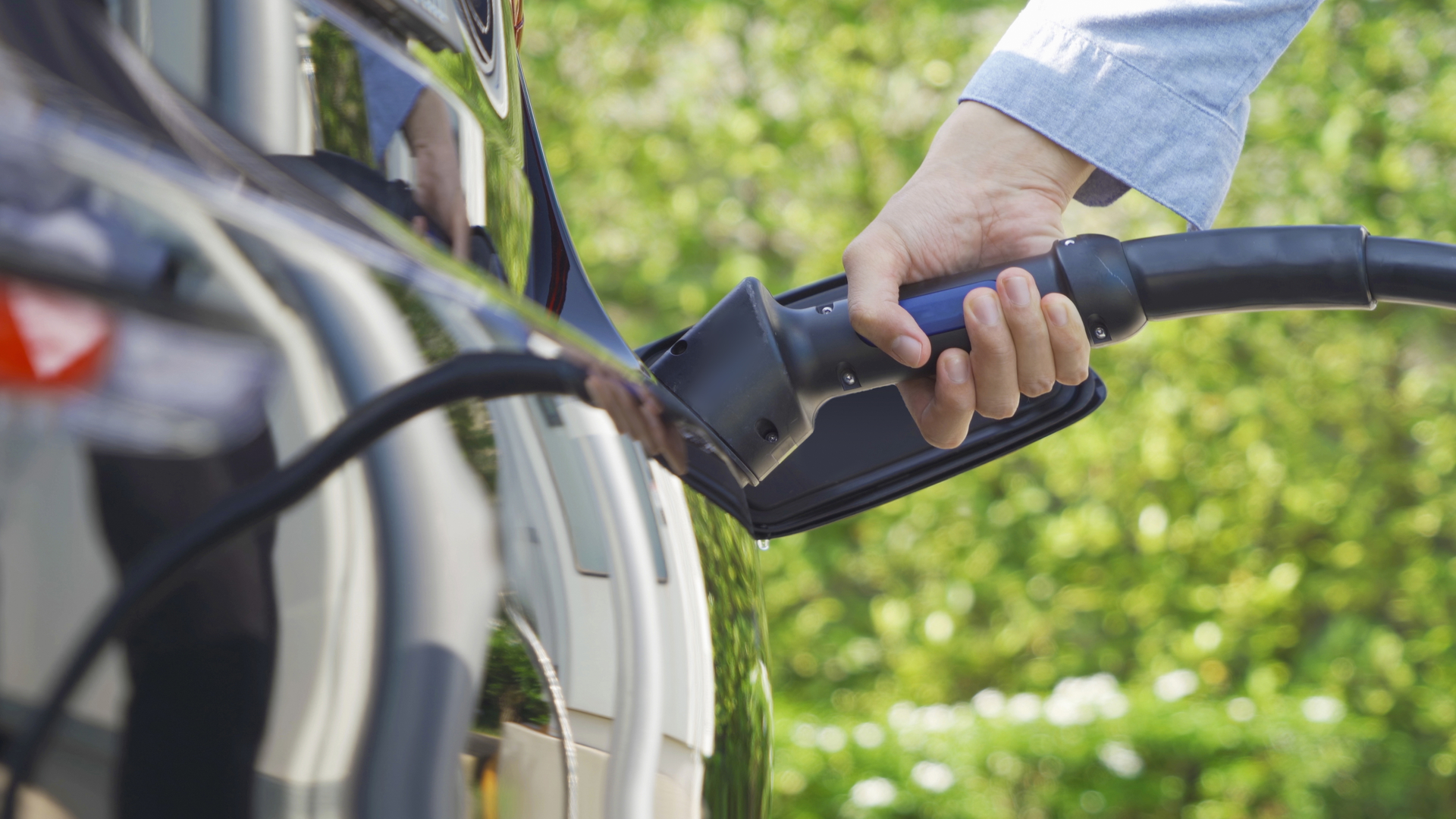 An electric vehicle being charged