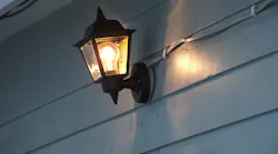 UF cable sandwiched between luminaire canopy and pancake-style box