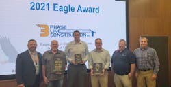 Three Phase Line Construction is the winner of Ameren’s 2021 Eagle, Best in Class, Best of the Best awards. Pictured left to right: Ty Lindhorst, Ameren Illinois, director of contractor services; and Three Phase Line employees Terry Long, Eric Burkey, Joseph Hamlin, Mike Wildman, and Mike Cherry. Three Phase Line Construction is the winner of Ameren’s 2021 Eagle, Best in Class, Best of the Best awards. Pictured left to right: Ty Lindhorst, Ameren Illinois, director of contractor services; and Three Phase Line employees Terry Long, Eric Burkey, Joseph Hamlin, Mike Wildman, and Mike Cherry.
