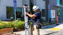electrical worker installing an ev charging station