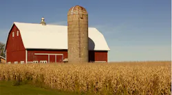 barn and silo beside field