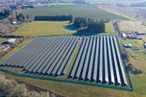large solar farm in rural setting