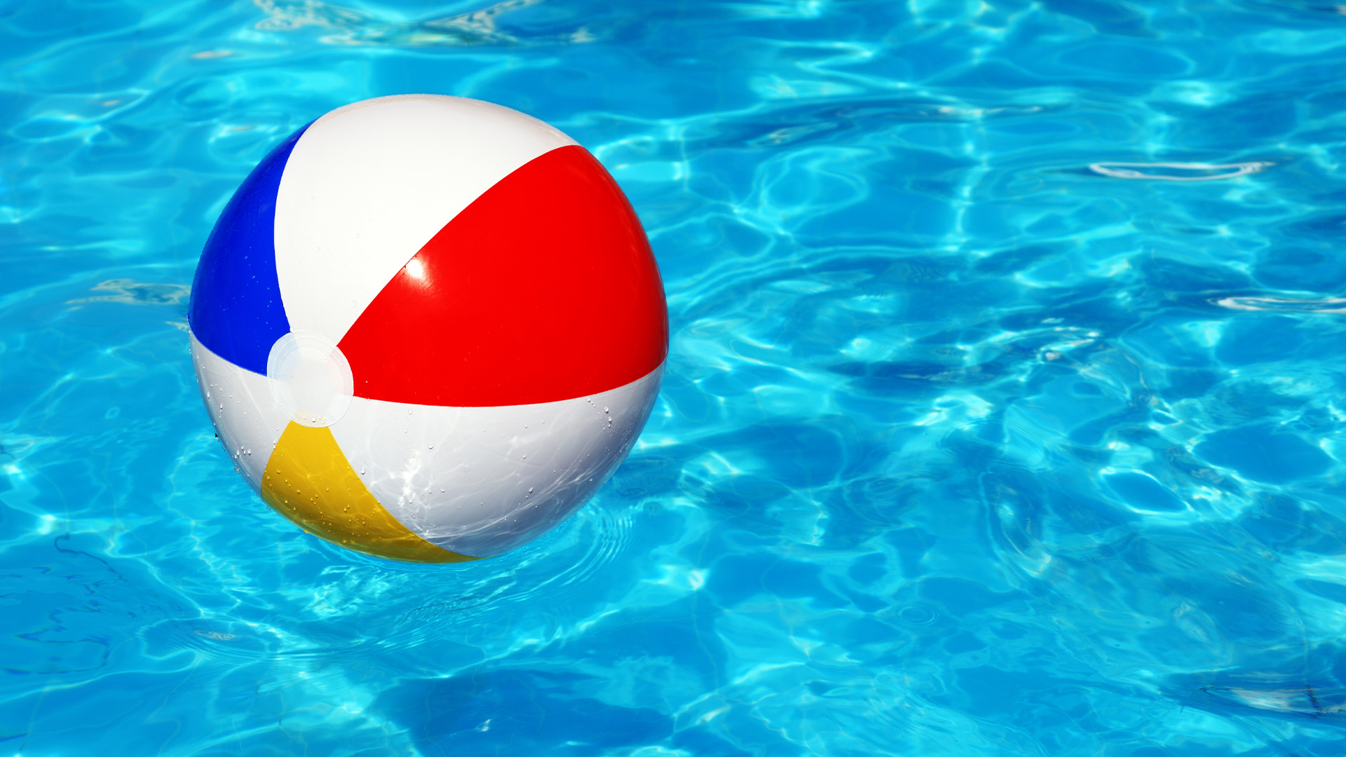 beach ball floating in a pool