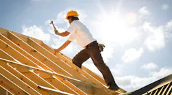 construction worker working on roof