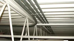 EMT raceways installed on bottom of metal-corrugated sheet roof decking
