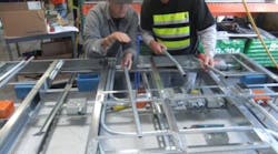 Photo 2. Had the electrical contractor not seen an opportunity to prefabricate the entire headwall as a preassembled section, then all of the work would have been completed on the job site as originally scheduled. Recognizing this opportunity saved thousands of hours. Photo 2. Had the electrical contractor not seen an opportunity to prefabricate the entire headwall as a preassembled section, then all of the work would have been completed on the job site as originally scheduled. Recognizing this opportunity saved thousands of hours.