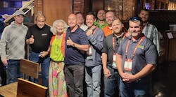 Vicki LaPlante, president emeritus of Joseph Groh Foundation, and board member John LaPlante (second from left) stand with some of the many contractors attending Service World Expo who helped raise $120,000 for the foundation.