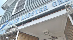 extension cord hanging below restaurant sign