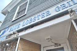 extension cord hanging below restaurant sign extension cord hanging below restaurant sign