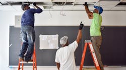 Contractors install a connected lighting system in an NGLS Living Lab.
