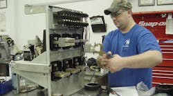 Photo 1. A technician working on a Westinghouse low-voltage power circuit breaker. Photo 1. A technician working on a Westinghouse low-voltage power circuit breaker.