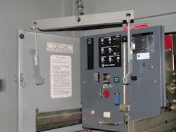 Photo 3a. This circuit breaker is ready to be lifted from its extension arms. Photo 3a. This circuit breaker is ready to be lifted from its extension arms.