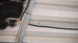 NM cable installed directly beneath metal corrugated roof