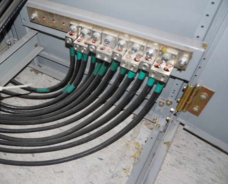 Photo 2. Terminal bars are often provided by equipment manufacturers to allow the connection of multiple conductors at one convenient location. Torque requirements apply to both the bolted connection of the lug to the terminal bar and the wire termination itself.