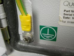 Photo 4. Here’s an example of “connections that are part of a listed assembly.” Panel makers will often identify termination points for the location of grounding and bonding connections. Notice the listed tool-crimped connector with the yellow plastic covering to identify AWG size for the connector. Additionally, the grounding symbol indicates the proper location for this bonding connection. Photo 4. Here’s an example of “connections that are part of a listed assembly.” Panel makers will often identify termination points for the location of grounding and bonding connections. Notice the listed tool-crimped connector with the yellow plastic covering to identify AWG size for the connector. Additionally, the grounding symbol indicates the proper location for this bonding connection.