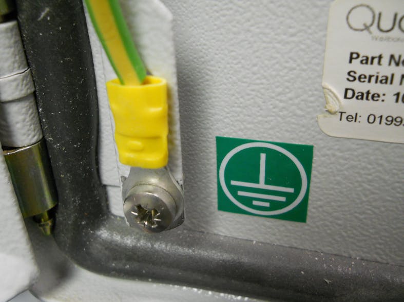 Photo 4. Here&rsquo;s an example of &ldquo;connections that are part of a listed assembly.&rdquo; Panel makers will often identify termination points for the location of grounding and bonding connections. Notice the listed tool-crimped connector with the yellow plastic covering to identify AWG size for the connector. Additionally, the grounding symbol indicates the proper location for this bonding connection.