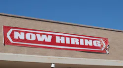 now hiring sign on building
