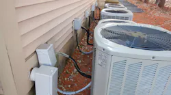 air conditioning units with disconnect installed behind unit