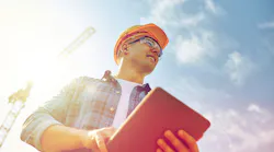 Construction worker with tablet
