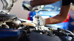 mechanic working on car in repair garage