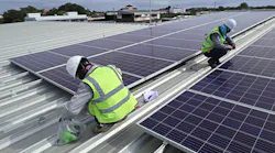 electricians installing solar PV panels