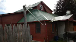 Airborne PVC conduit on back of restaurant