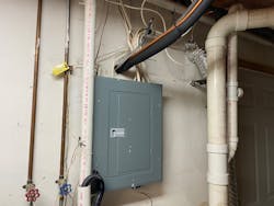 refrigerant lines installed above panelboard