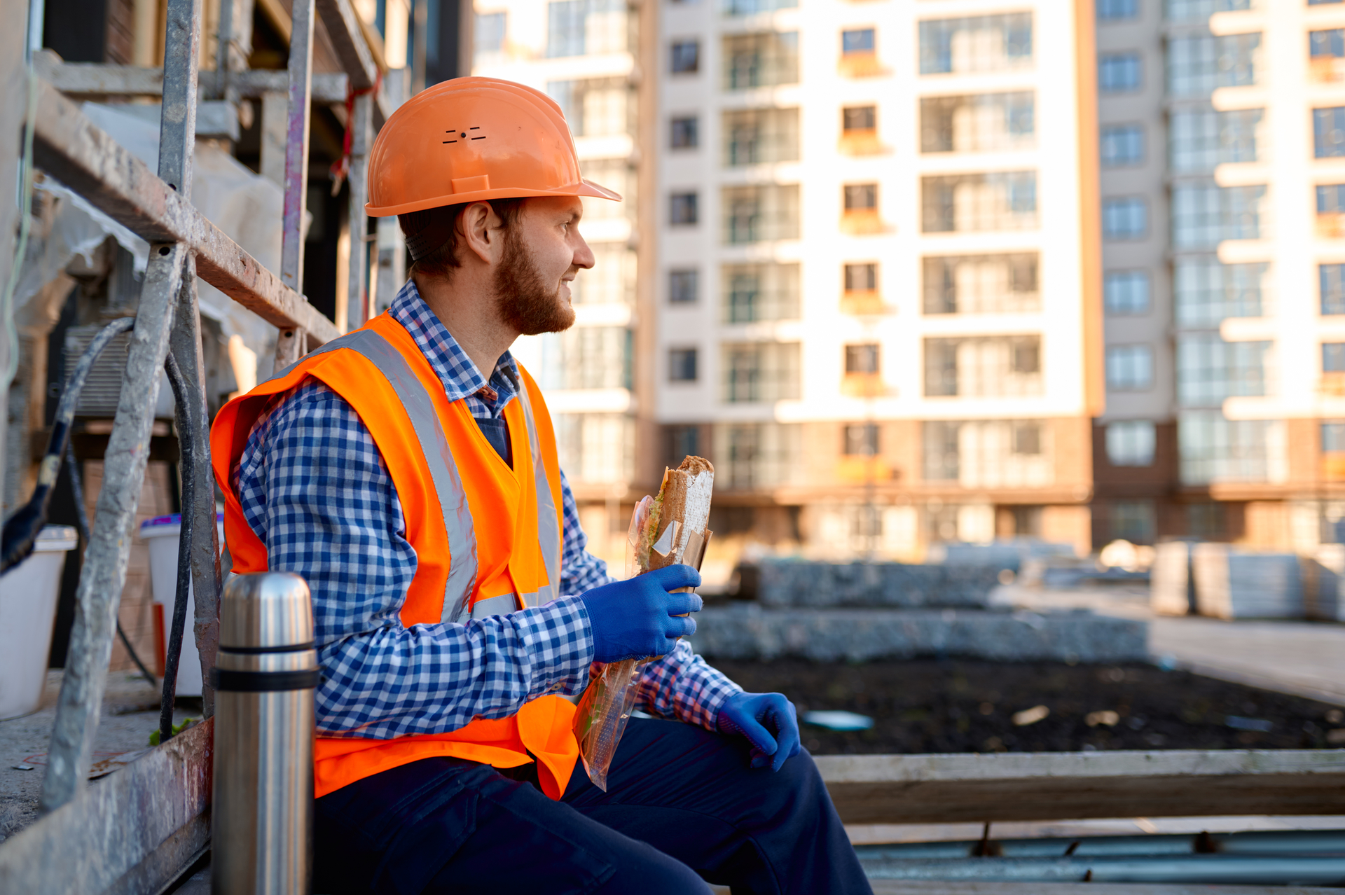 construction worker eating sandwich