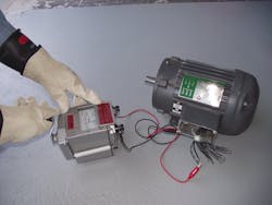 Photo 1b. This megohmmeter requires hand cranking of an internal generator for the duration of the test to provide the test voltage. An analog scale on the face provides the resistance in megohms. Photo 1b. This megohmmeter requires hand cranking of an internal generator for the duration of the test to provide the test voltage. An analog scale on the face provides the resistance in megohms.