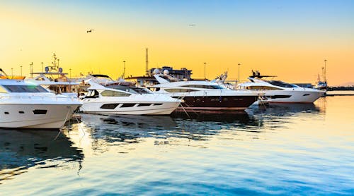 luxury yachts at sunset