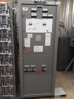 Photo 1. A typical UPS system and DC battery bank. Photo 1. A typical UPS system and DC battery bank.