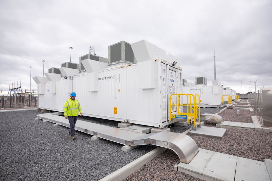 Kyle Murray, NYPA Construction Engineer, walks the Northern New York battery storage project, with construction completed. The Willis substation is adjacent to the facility.